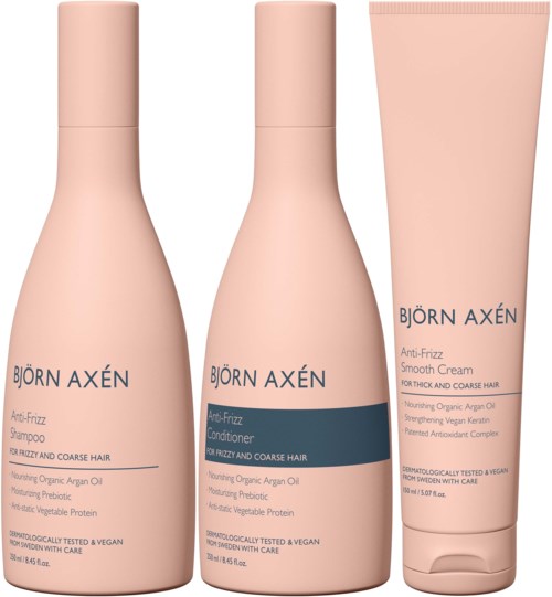 Drie roze haarverzorgingsproducten: shampoo, conditioner en creme van Björn Axén voor dik en kroes haar.