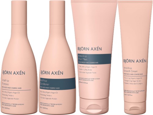 Vier haarverzorgingsproducten van Björn Axén, waaronder shampoo, conditioner, haarmasker en stylingcrème, in roze flessen.