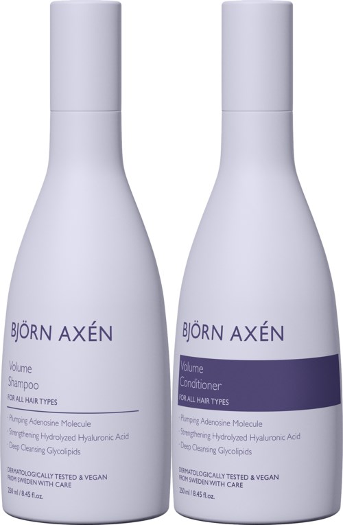 Two white bottles labeled 'Björn Axén' for volume shampoo and conditioner stand side by side.