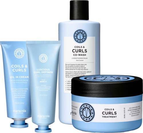 Set of hair care products includes a co-wash, treatment, conditioner, and oil cream in blue containers.
