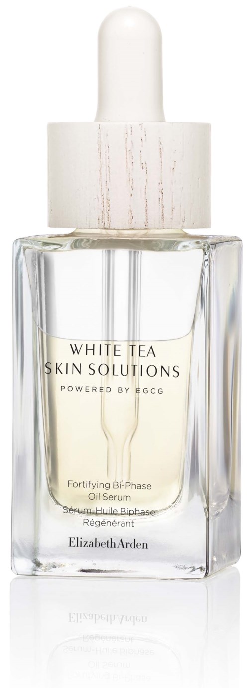 Een doorzichtige glazen fles met een witte pipethouder, bevat een huidverzorgingsserum met de tekst "White Tea Skin Solutions."