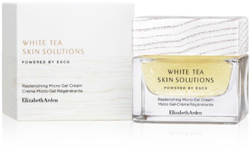 Ett glasburk med gul kräm, låda och text för Elizabeth Arden's White Tea Skin Solutions produkt.