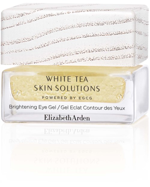 A small jar of Elizabeth Arden eye gel with gold-colored content and white and gold packaging. The label mentions skin solutions and brightening.