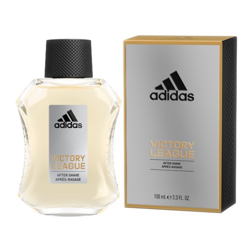 butelka Adidas Victory League po goleniu obok pudełka, z przezroczystego szkła z czarnym korkiem.