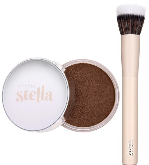 A round container of brown powder and a large makeup brush with a white handle.