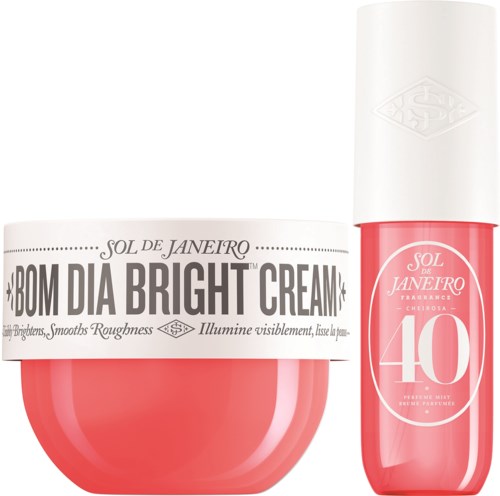 Zwei Produkte von Sol de Janeiro: eine Creme und ein Spray, beide in rosa Behältern mit weißen Verschlüssen und Etiketten.