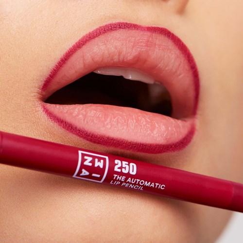 Close-up of lips with red lip liner and a red lip pencil nearby.