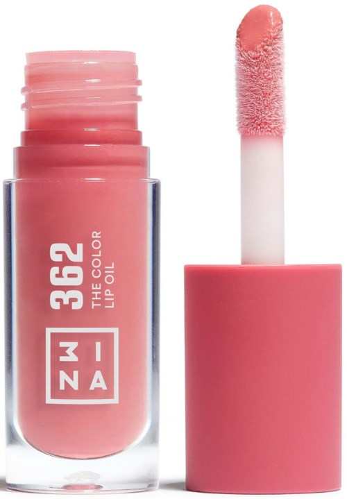 Lippenstiftflasche mit rosa Farbe und Applikator darüber, zeigt rosa Lippenstift innen.