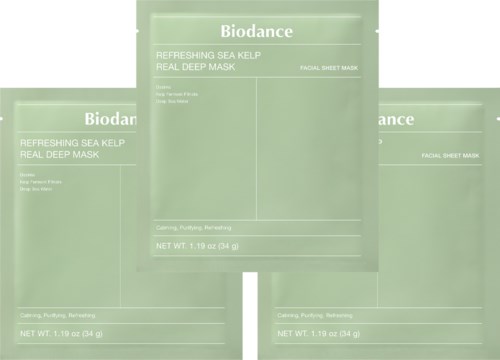 Three green packets of Biodance sea kelp facial sheet mask with product details on the front.