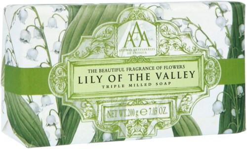 A soap box with a green and white design, featuring lily of the valley flowers and decorative borders.