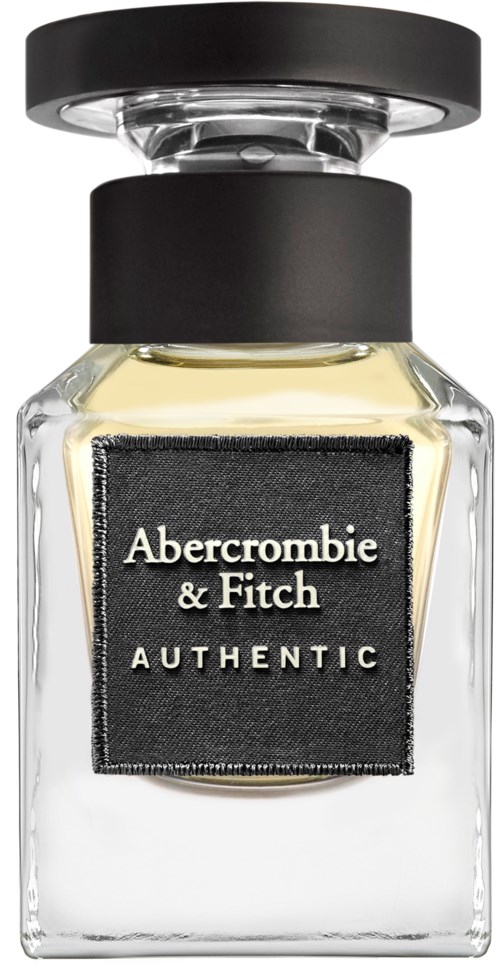 En tydlig parfymflaska med svart lock. Den har en svart etikett med vit text som säger "Abercrombie & Fitch AUTHENTIC."
