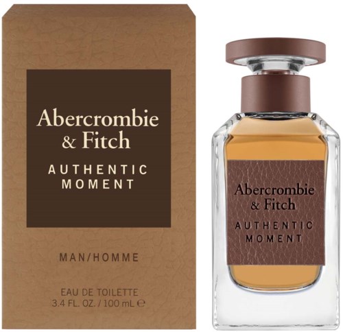 Een parfumfles en doos met 'Abercrombie & Fitch Authentic Moment'. De doos is bruin, en de fles heeft een bruine dop.