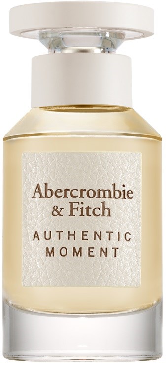 En parfythylsa i glas med vita och gyllene detaljer, märkt 'Abercrombie & Fitch Authentic Moment.'