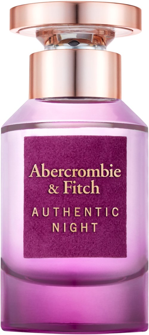 Een roze fles met een roségouden dop, gemerkt 'Abercrombie & Fitch Authentic Night.' Het lijkt op een parfum.