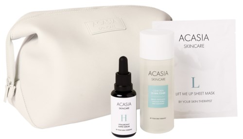 Huidverzorgingsproducten met tas en instructieblad van Acasia, inclusief serum, toner en maskersheet.