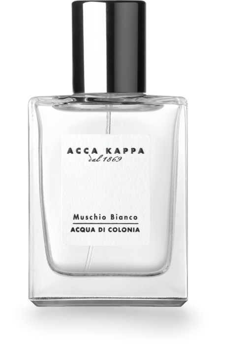 A clear glass perfume bottle with a black cap, labeled 'ACCA KAPPA Musschio Bianco ACQUA DI COLONIA.'