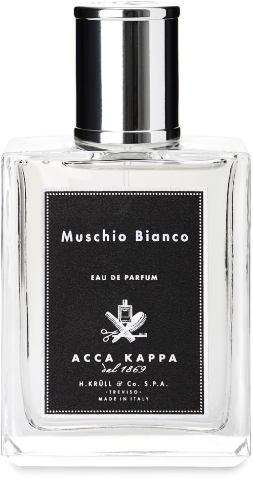 Eine klare Parfümflasche mit schwarzem Etikett, silberner Kappe und der Aufschrift 'Muschio Bianco' mit zusätzlichem Text.