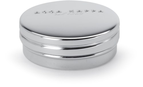 A shiny silver round container with embossed letters on top, reflecting light.