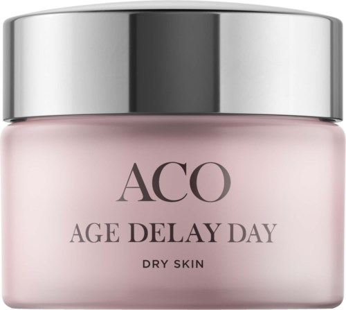 En rosa burk med silverlock märkt 'ACO AGE DELAY DAY DRY SKIN'.