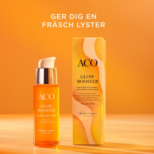 Een huidserumfles en doos met heldere oranje en gele kleuren, bevordert een gezonde glans met vitamine C.