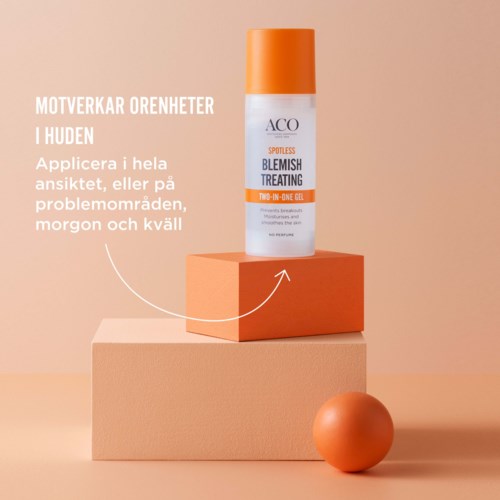 En hudvårdsprodukt märkt 'Blemish Treating' på en orange och rosa display, med ett runt orange föremål i närheten.