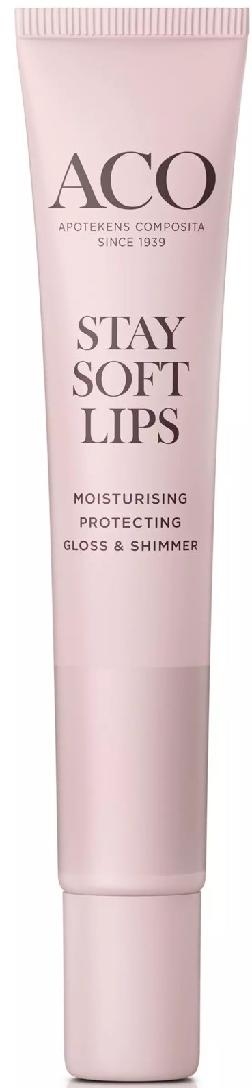 A pink tube of lip balm or gloss labeled 'ACO Stay Soft Lips,' with description 'Moisturising, Protecting, Gloss & Shimmer.'