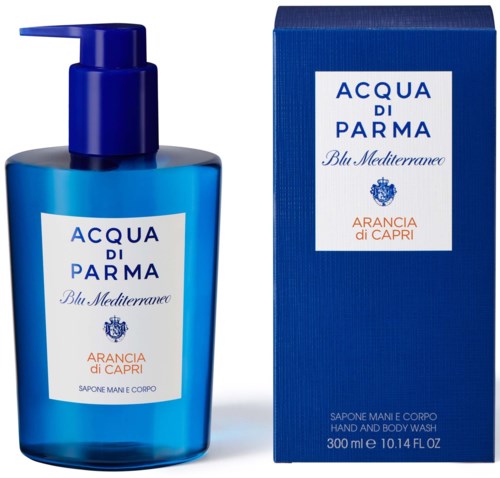 A blue hand and body wash bottle with a pump next to its matching blue box, both labeled with product details.