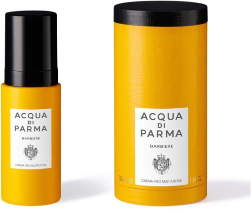Een gele fles en een bijpassend gele cilindervormige doos met labels, onderdeel van de Acqua di Parma-productlijn.