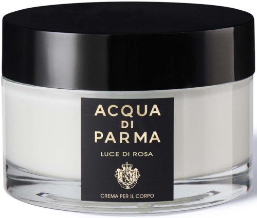 En vit kräm i en glasburk med svart lock, märkt 'Acqua di Parma' och 'Luce di Rosa'.