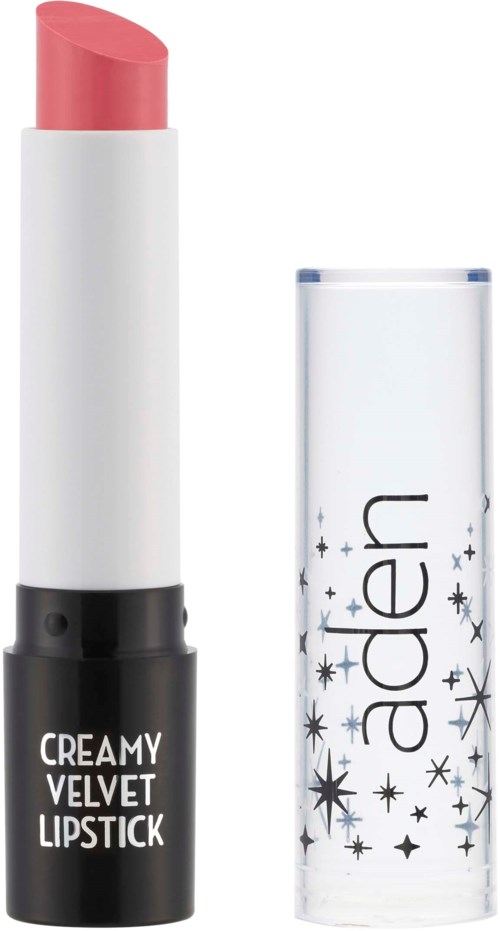 En rosa läppstift i en vit och svart rör med etiketten "Creamy Velvet Lipstick", utan lock. Locket bredvid har stjärnmönster.