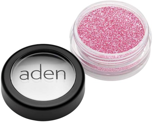 Pink glitter beauty product in a small container with a black lid, labeled "aden."