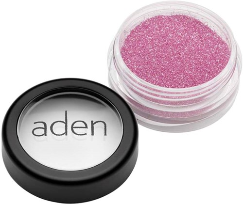 Pink glittery cosmetic product in a small container with black lid marked 'aden'.