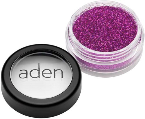 Purple glitter in a small container, with a lid that says "aden."