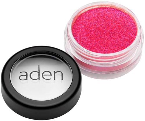 A small round container with pink glitter eyeshadow and a lid with the word 'aden' on it.