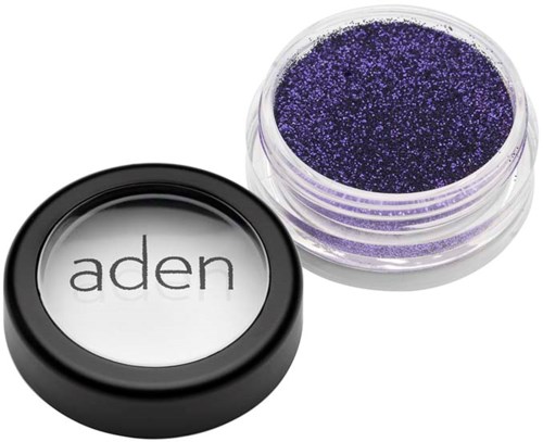 A small jar of purple glitter and a black lid with the brand name 'aden'.
