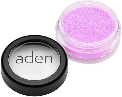 Pink glitter powder in a small container, with a black lid marked 'aden' beside it.