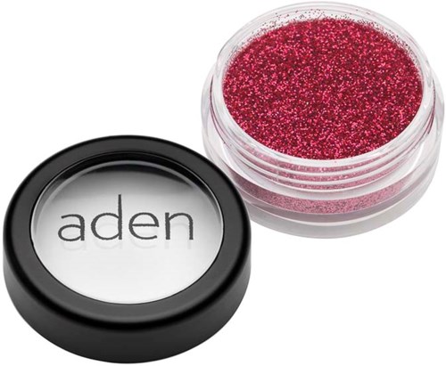 A small container of red glitter and a black lid labeled "aden" are shown.