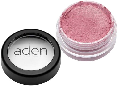 A small round container with pink makeup inside, and a lid with the name 'aden' on it.