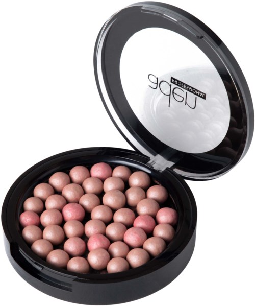 A round makeup compact with pink and beige spherical powders inside, open to show the powders and mirror.