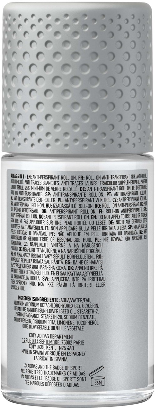 Een witte spraybus met een textuurlijke, gearceerde dop en Franse tekst op het label met ingrediënten en gebruik.
