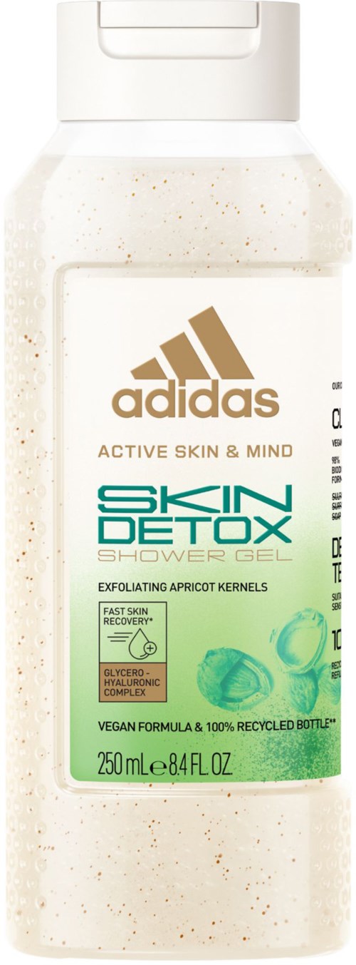 Een witte fles met een dekschap met Adidas Skin Detox Douchegel, gelabeld als exfoliërend met abrikozenpitten.