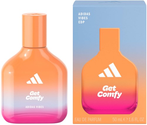 Oranje en roze parfumfles met witte tekst en logo naast de bijpassende doos. De doos matcht de kleuren van de fles.
