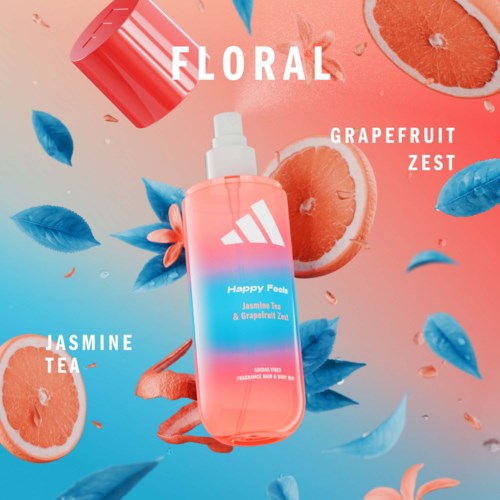 Eine Blumenspray-Flasche mit der Aufschrift Happy Feels Jasmine Tea und Grapefruit Zest, umgeben von Grapefruitscheiben und blauen Blättern.