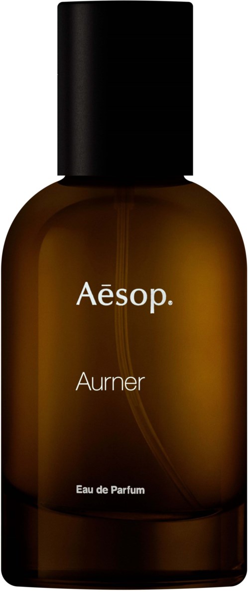 Eine braune Flasche mit schwarzem Deckel, beschriftet 'Aesop Aurner Eau de Parfum'.