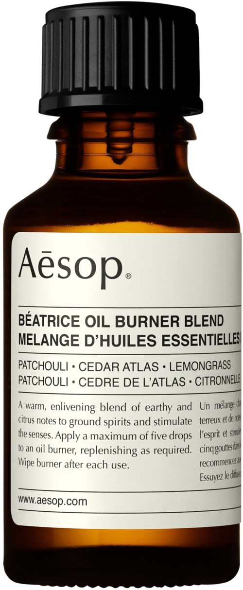 Bernsteinfarbene Flasche mit Aesop Béatrice Öl Brenner Mischung mit Zutatenliste auf Beschriftung.
