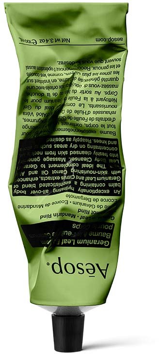 Green tube with black text and a black cap, labeled as Aesop, mostly used for skincare products.