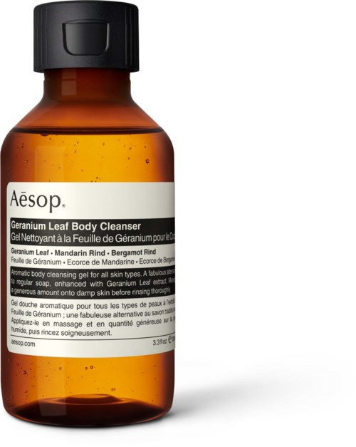 A brown bottle of Aesop Geranium Leaf Body Cleanser with a black cap and white label.