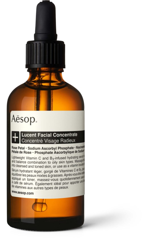 Eine kleine braune Flasche mit schwarzem Tropferdeckel, beschriftet Aesop Gesichtsserum, mit Text auf Englisch und Französisch.