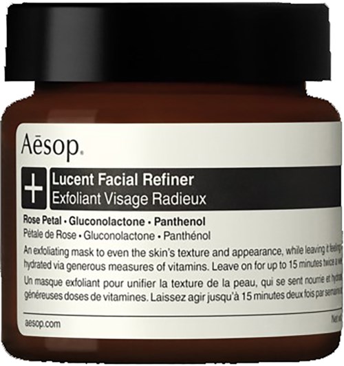Ein Hautpflegeglas mit der Aufschrift 'Aesop Lucent Facial Refiner' mit Inhaltsstoffen wie Rosenblatt, Gluconolacton und Panthenol.