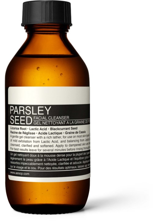 Eine kleine braune Flasche mit schwarzem Deckel, beschriftet als Petersiliensamen-Gesichtsreiniger.